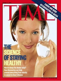 Viršelyje – anoniminė baltaodė jauna pusnuogė moteris baltame fone. Portrete matoma galva, kaklas ir pečiai, kairė ranka, laikanti stiklinį obuolį. Moters plaukai surišti. Jos akių žvilgsnis, nukreiptas į žiūrovą, ir subtili šypsena implikuoja moters protą, žinojimą, gundymą. Tekstas pateikiamas viršelio kairiame kampe: „The Science of Staying Healthy. Want to Keep the Doctor Away? New Discoveries Can Help Prevent Everything from Obesity to Cancer to Heart Desease“ (Sveikatos išsaugojimo mokslas. Nori nesilankyti pas gydytoją? Nauji atradimai gali padėti išvengti visko – nuo nutukimo iki vėžio ar širdies ligų.). Teksto fragmentas „The Science of Staying Healthy“ (Sveikatos išsaugojimo mokslas) pateiktas didžiosiomis raidėmis skirtingomis spalvomis.